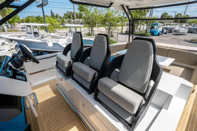  Yacht Photos Pics 2025 De Antonio Yachts D36 OPEN interior with modern seating and steering console.