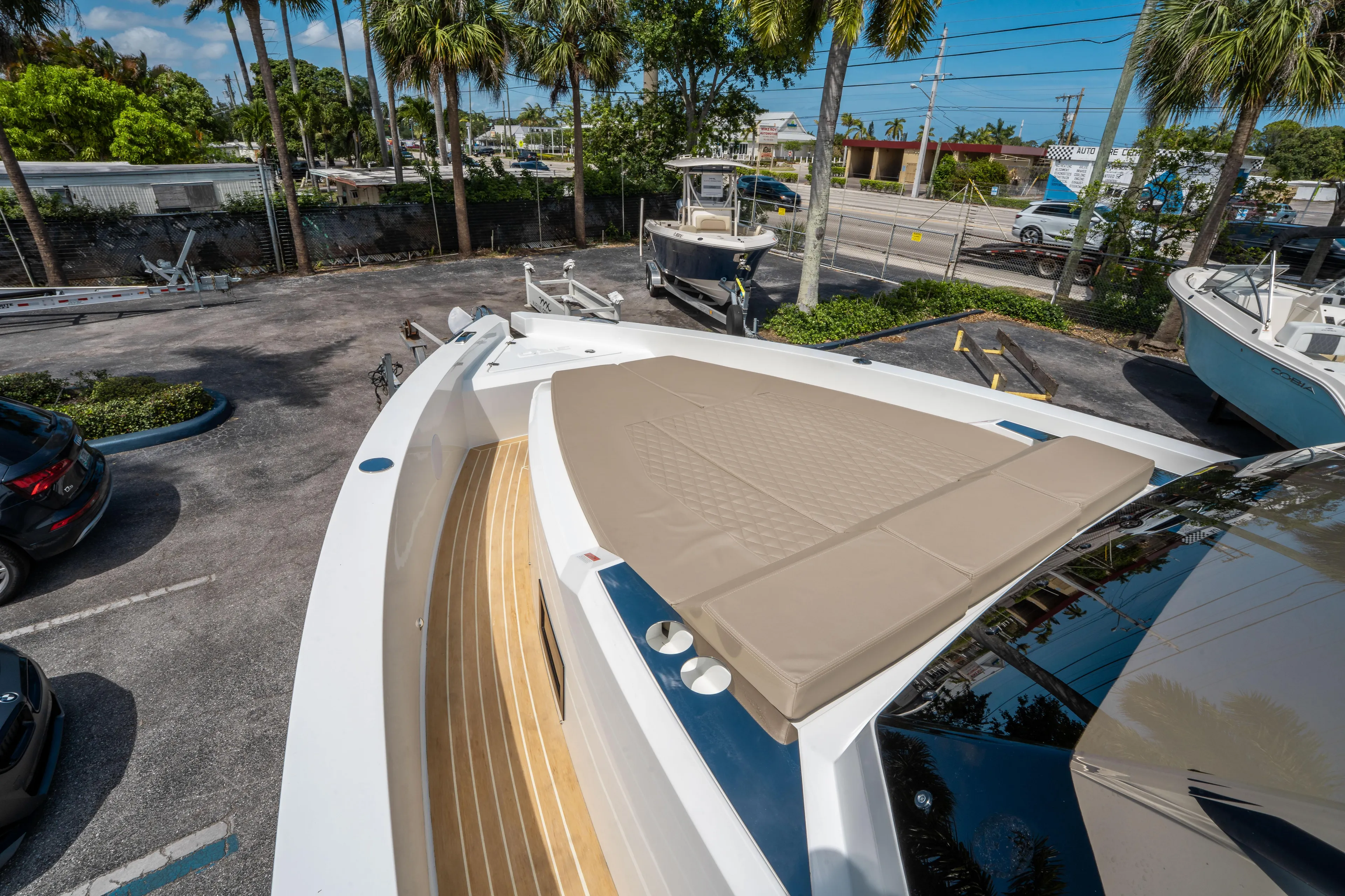  Yacht Photos Pics 2025 De Antonio Yachts D36 OPEN with sunbed, docked in a tropical setting.