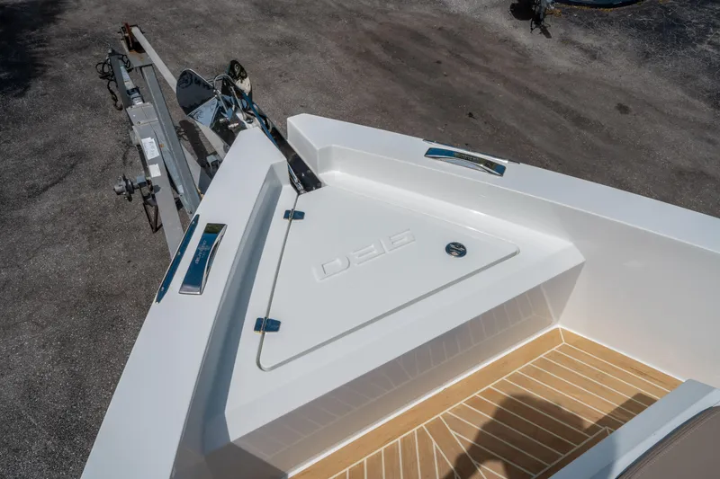  Yacht Photos Pics 2025 De Antonio Yachts D36 OPEN bow with sleek design and wood-textured flooring.