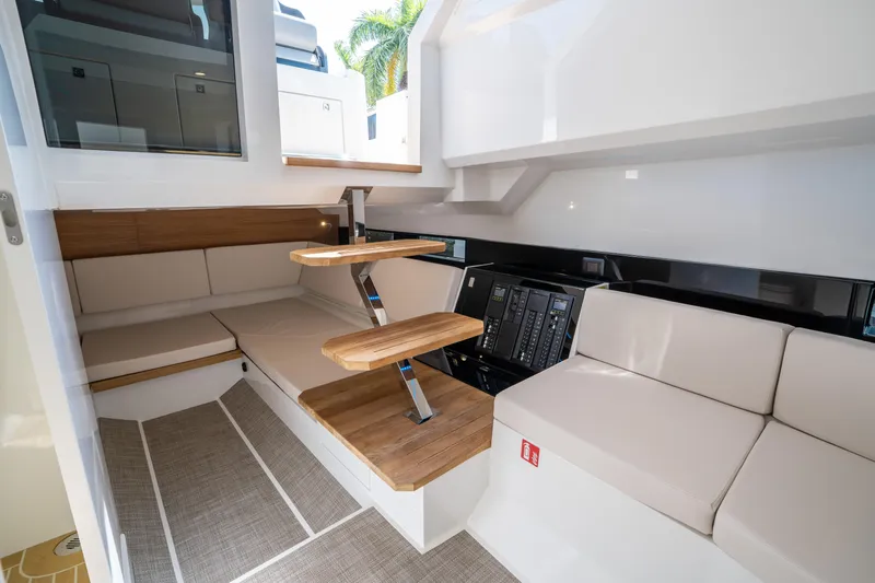  Yacht Photos Pics 2025 De Antonio Yachts D36 OPEN interior with modern seating and wooden accents.