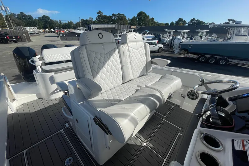 Yacht Photos Pics 2020 Fountain 38 Center Console boat with luxurious seating and modern helm controls.