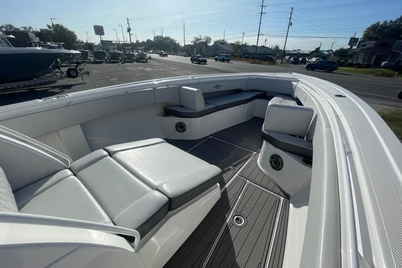  Yacht Photos Pics 2020 Fountain 38 Center Console boat interior with cushioned seating and sleek design.