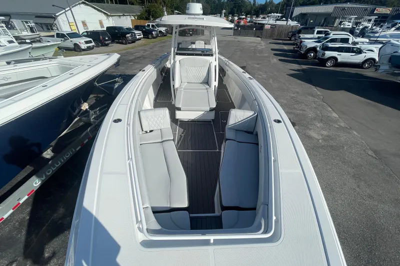  Yacht Photos Pics 2020 Fountain 38 Center Console boat with sleek seating, docked at a marina.