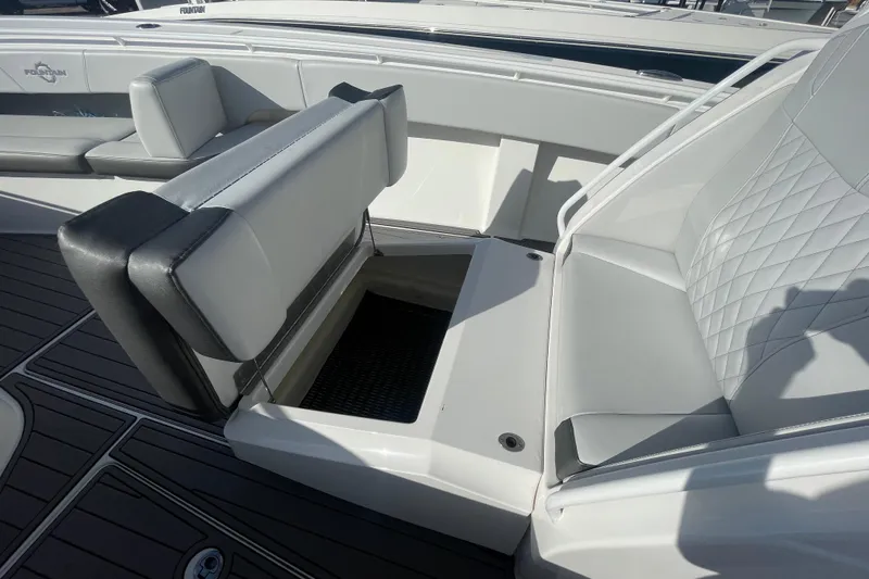  Yacht Photos Pics 2020 Fountain 38 Center Console boat interior with open storage compartment and cushioned seating.