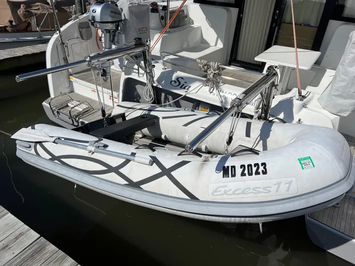 Sia Yacht Photos Pics Inflatable boat Excess XCS 11, 2022 model, docked with outboard motor.