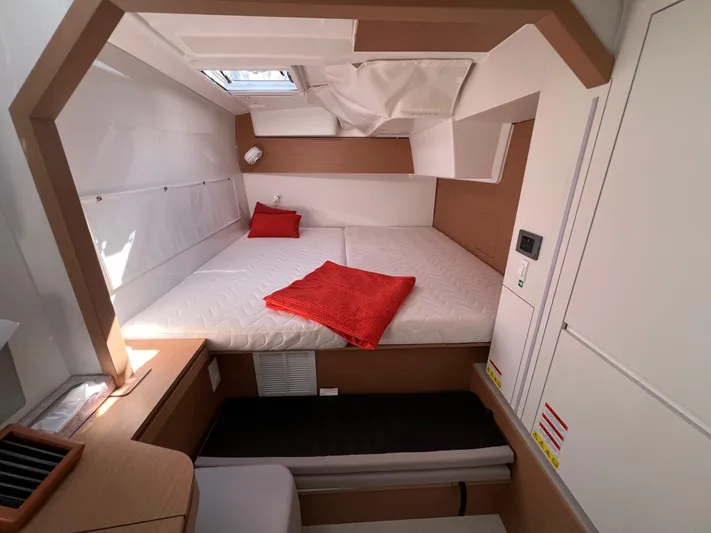 Sia Yacht Photos Pics Cozy cabin interior of 2022 Excess XCS 11 yacht with red accents.