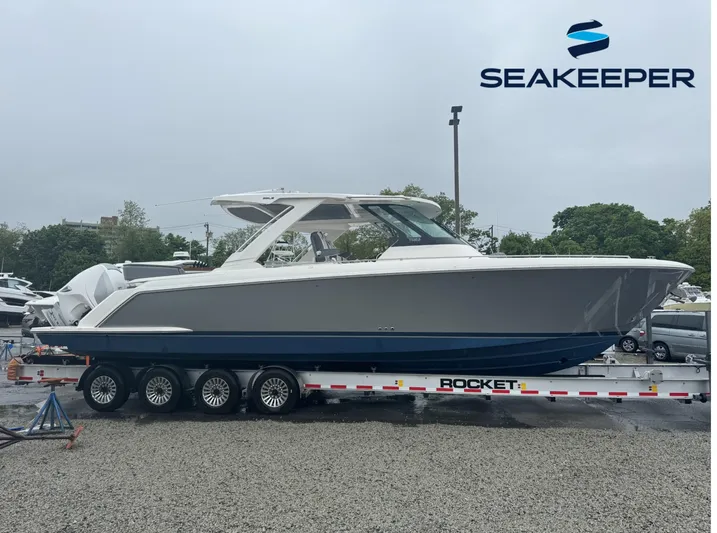 Oneone Yacht Photos Pics 2019 Tiara Sport 38 LS boat on trailer, displayed outdoors with Seakeeper logo.