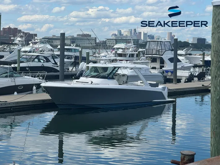 Oneone Yacht Photos Pics 2019 Tiara Sport 38 LS boat docked in marina, Seakeeper logo visible.