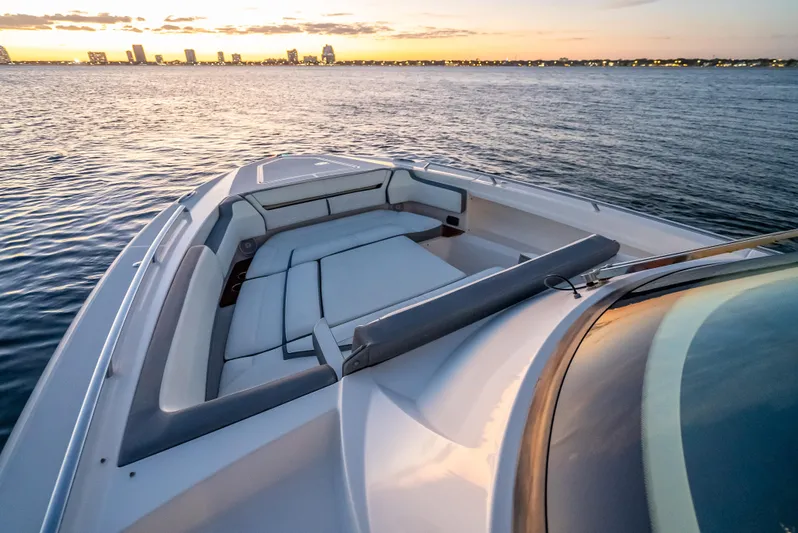 Oneone Yacht Photos Pics 2019 Tiara Sport 38 LS boat with sunset cityscape in the background.