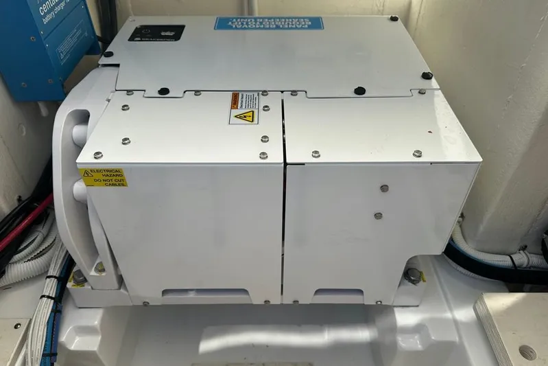  Yacht Photos Pics Electrical equipment inside a 2022 Tiara Yachts 38 LS, featuring safety warnings.