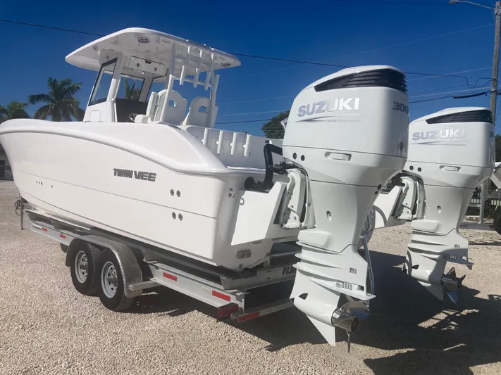  Yacht Photos Pics 2025 Twin Vee 280GFX2 boat with dual Suzuki engines on trailer.
