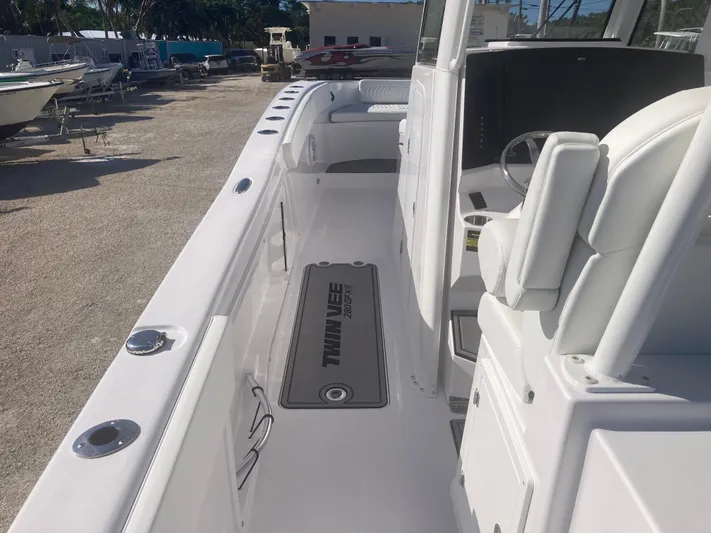  Yacht Photos Pics 2025 Twin Vee 280GFX2 boat interior with white seating and sleek design.