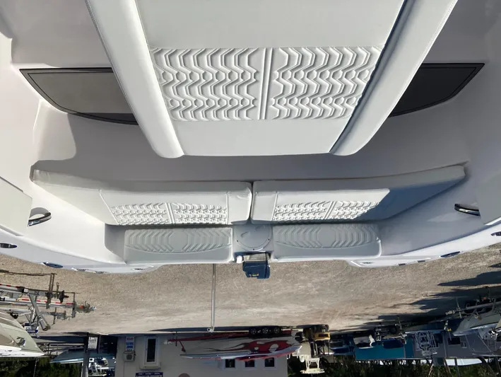  Yacht Photos Pics 2025 Twin Vee 280GFX2 boat interior with white cushioned seating.