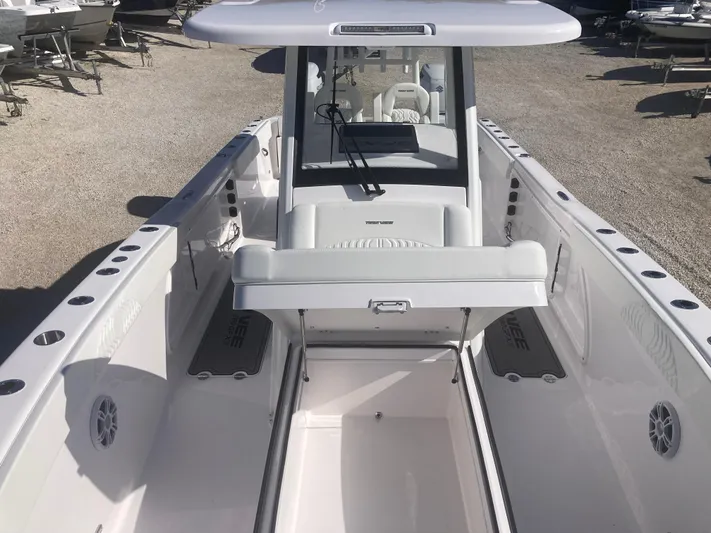  Yacht Photos Pics 2025 Twin Vee 280GFX2 boat interior with spacious deck and modern console design.