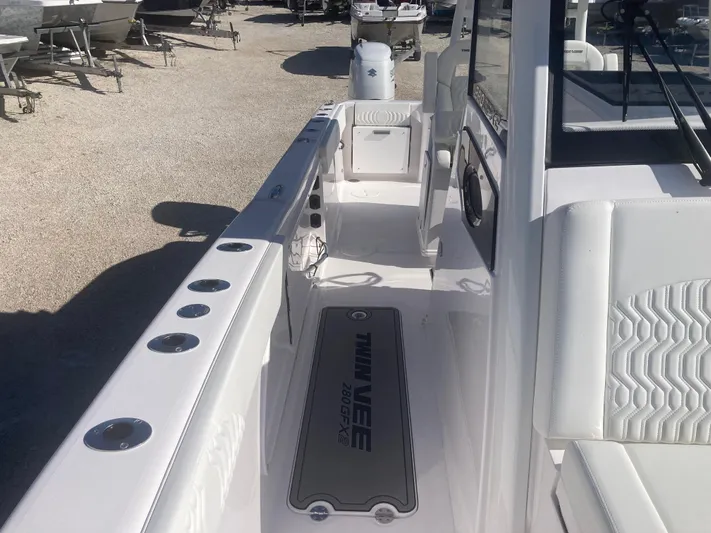  Yacht Photos Pics 2025 Twin Vee 280GFX2 boat interior with sleek white seating and modern design.