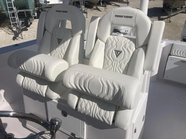  Yacht Photos Pics 2025 Twin Vee 280GFX2 boat seats with white leather upholstery and embossed design.
