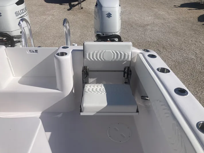  Yacht Photos Pics 2025 Twin Vee 280GFX2 boat interior with seating and Suzuki outboard motor.