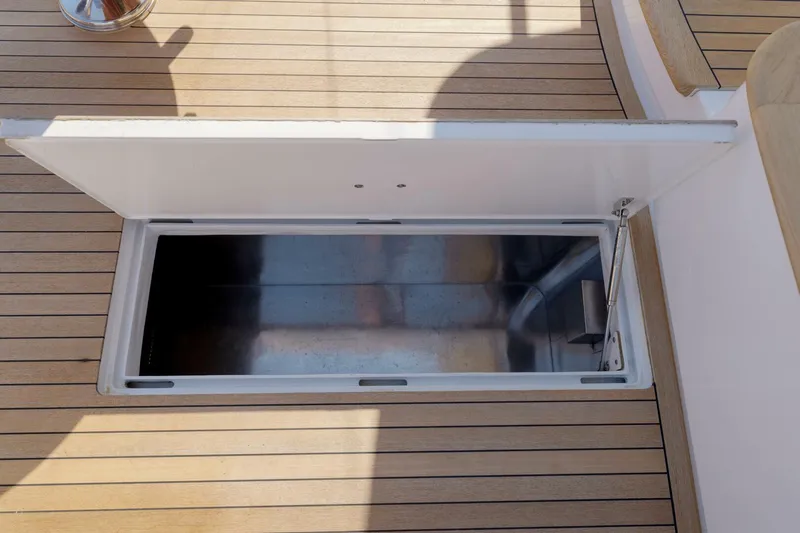 Salemwolf Yacht Photos Pics Open storage compartment on Garlington 61 C yacht, 2000 model, with wooden deck.