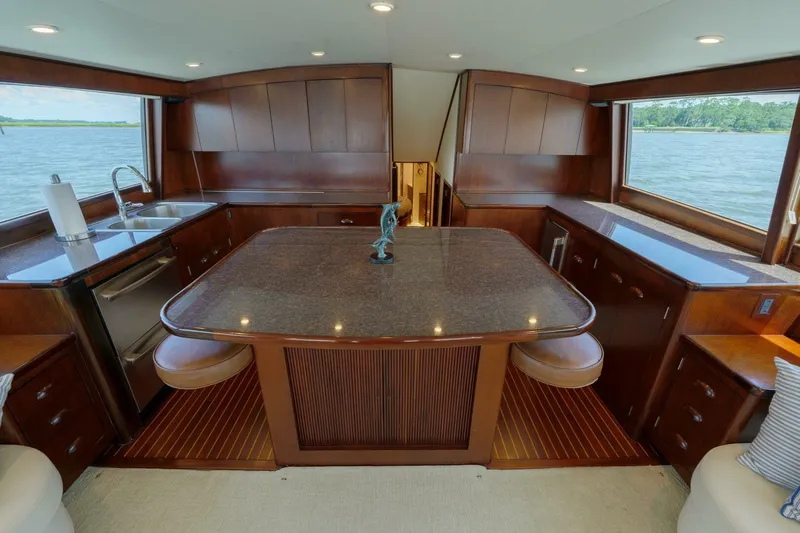 Salemwolf Yacht Photos Pics Luxurious interior of a 2000 Garlington 61 C yacht with elegant wood finishes and ocean view.