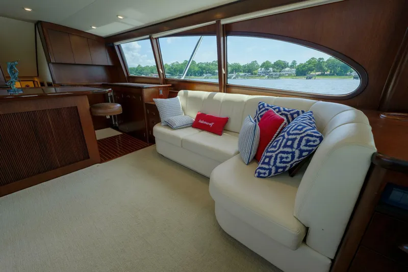 Salemwolf Yacht Photos Pics Luxurious Garlington 61 C yacht interior with plush seating and scenic window view.