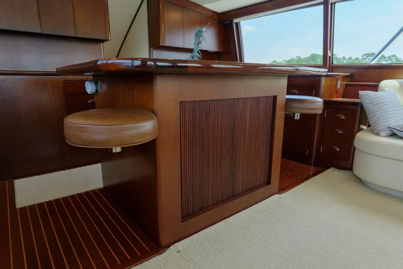 Salemwolf Yacht Photos Pics Luxurious wooden interior of a 2000 Garlington 61 C yacht with leather seating.