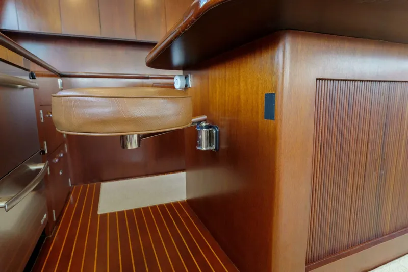 Salemwolf Yacht Photos Pics Luxurious wooden interior of a 2000 Garlington 61 C yacht with leather seating.