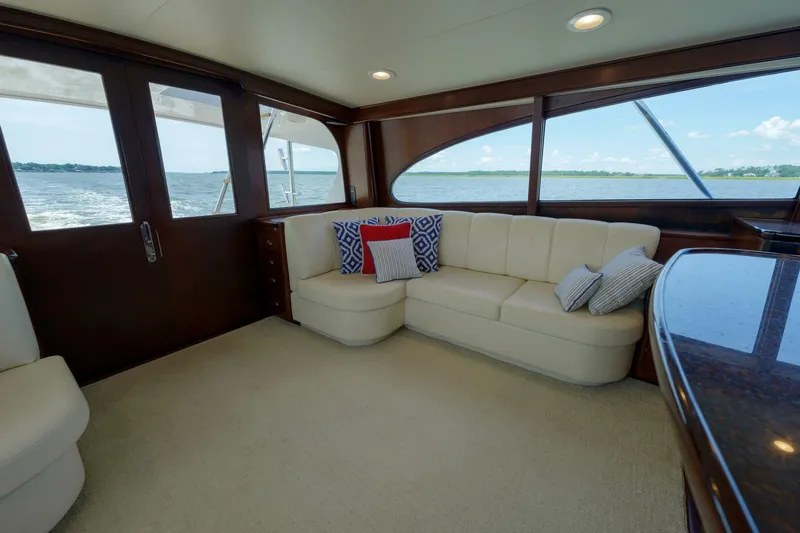 Salemwolf Yacht Photos Pics Luxurious interior of 2000 Garlington 61 C yacht with plush seating and scenic ocean view.