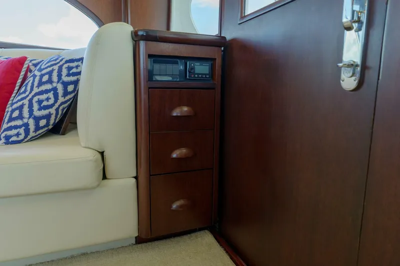 Salemwolf Yacht Photos Pics Interior of 2000 Garlington 61 C yacht with wooden cabinetry and plush seating.