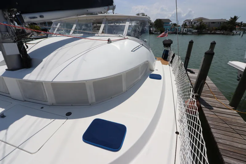  Yacht Photos Pics Lagoon 380 catamaran docked, showcasing deck and cabin, 2001 model.