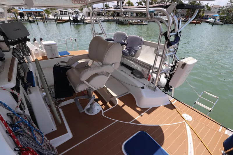  Yacht Photos Pics Lagoon 380 catamaran cockpit with seating, ropes, and water view, 2001 model.