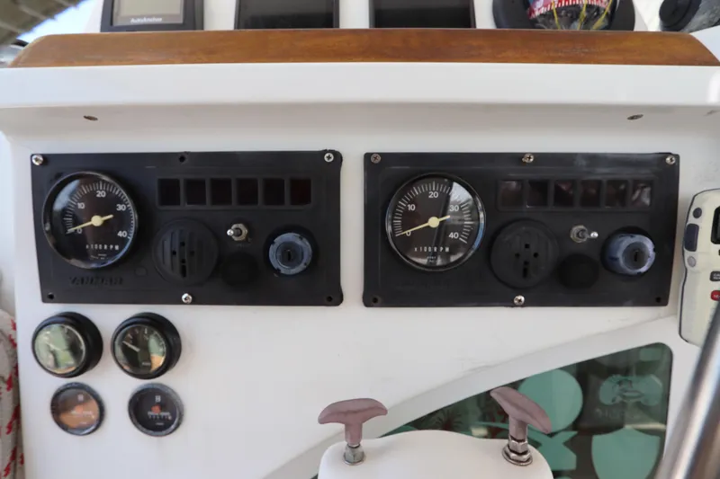 Yacht Photos Pics Control panel of a 2001 Lagoon 380 catamaran with gauges and dials.