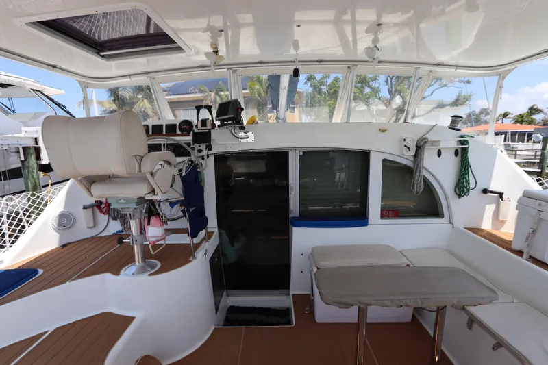  Yacht Photos Pics Interior view of a 2001 Lagoon 380 catamaran, featuring helm and seating area.