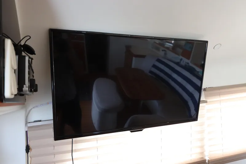  Yacht Photos Pics Flat-screen TV mounted on a wall inside a 2001 Lagoon 380 catamaran.