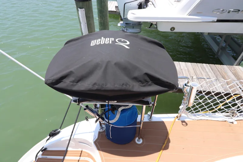  Yacht Photos Pics Weber grill on Lagoon 380 catamaran deck, 2001 model, docked by water.