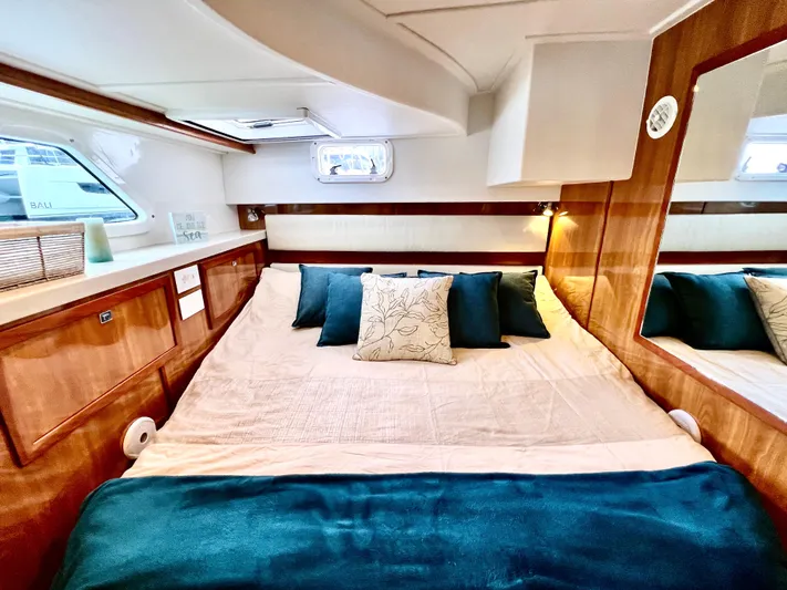 Walkabout Yacht Photos Pics Luxurious cabin interior of 2019 Royal Cape Catamarans 530 with cozy bedding.