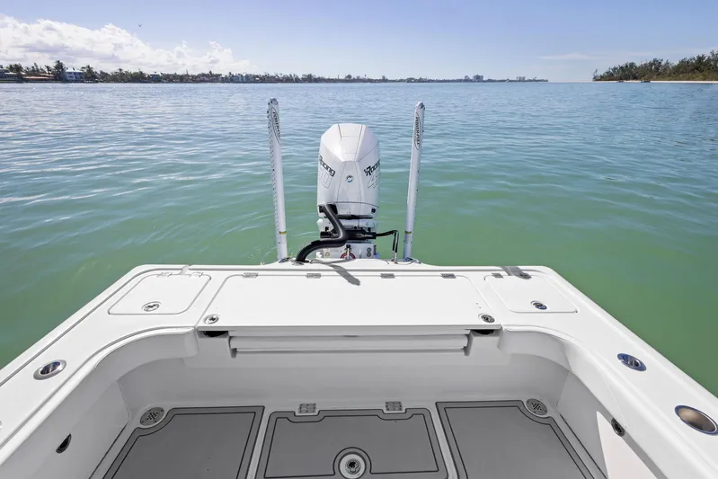  Yacht Photos Pics 2022 Barker Boatworks 26 Open on calm water, showcasing rear deck and outboard motor.