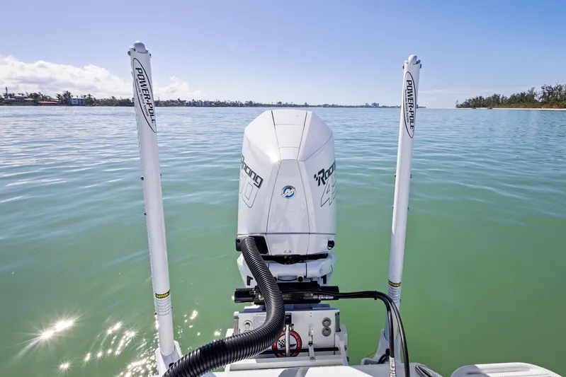  Yacht Photos Pics 2022 Barker Boatworks 26 Open on calm water, featuring dual power poles and outboard motor.