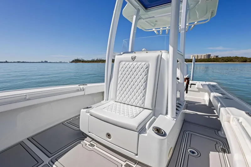  Yacht Photos Pics 2022 Barker Boatworks 26 Open, luxurious seating, sleek design, calm waters, clear sky.