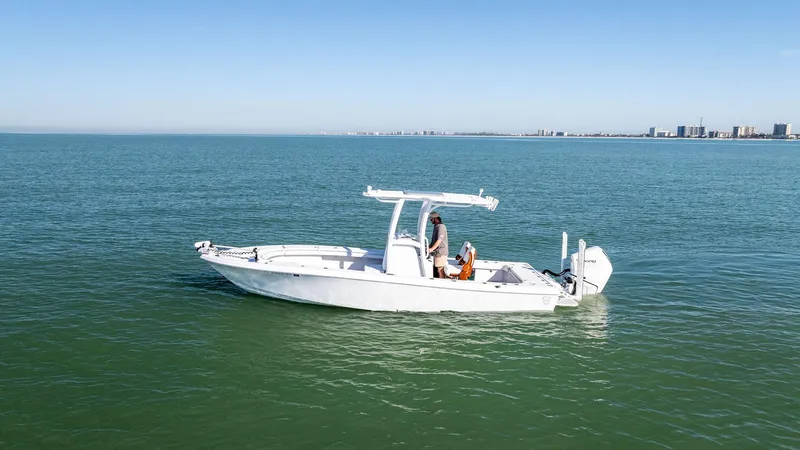  Yacht Photos Pics 2022 Barker Boatworks 26 Open on calm waters, clear sky in the background.