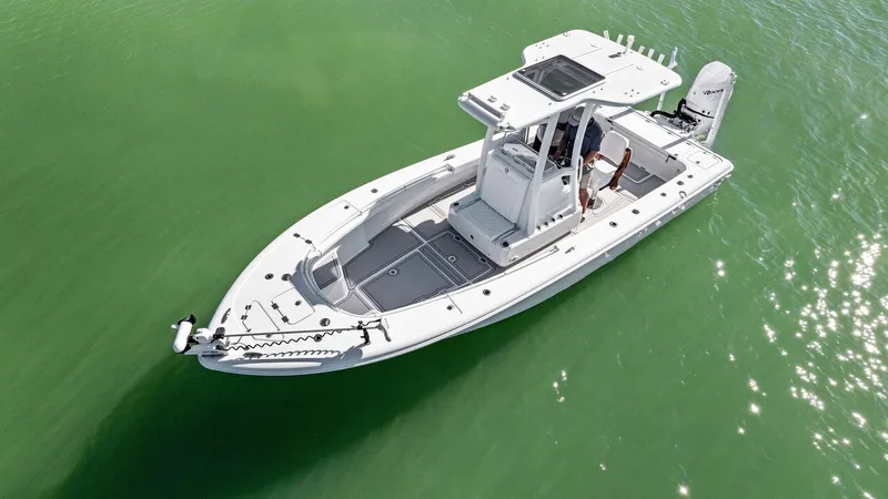  Yacht Photos Pics 2022 Barker Boatworks 26 Open on calm green water, aerial view.