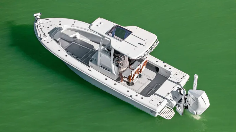  Yacht Photos Pics 2022 Barker Boatworks 26 Open in green water, aerial view.