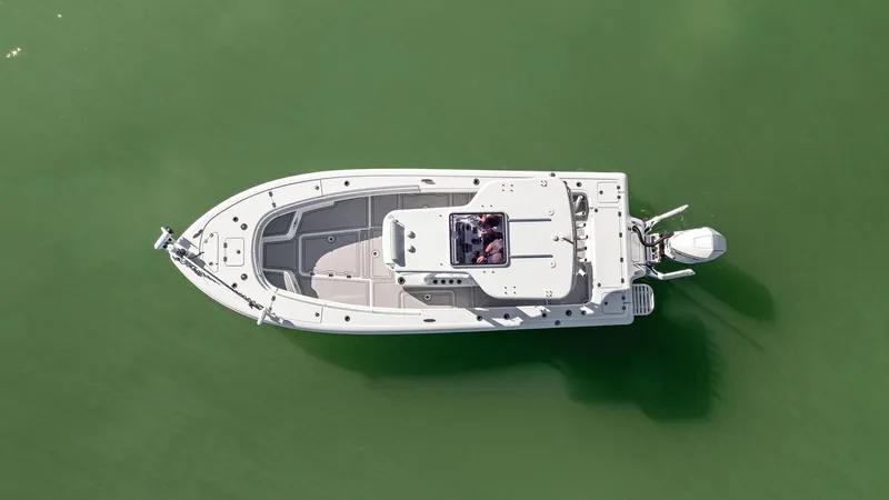  Yacht Photos Pics Aerial view of 2022 Barker Boatworks 26 Open on green water.