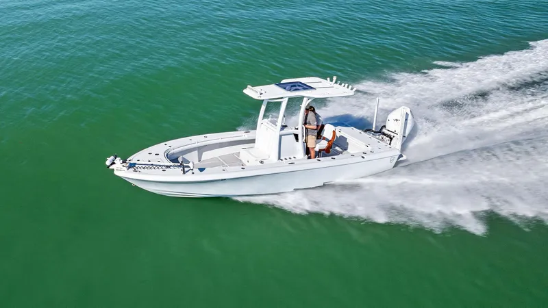  Yacht Photos Pics 2022 Barker Boatworks 26 Open cruising on clear green water.