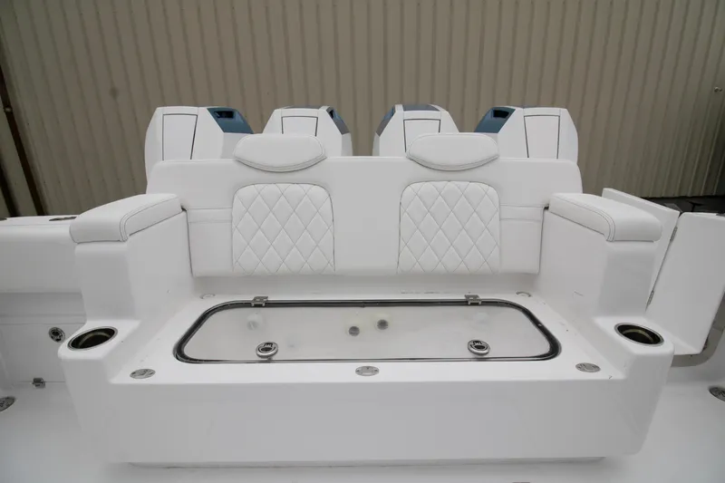  Yacht Photos Pics 2025 HCB 42 Lujo boat seating with white upholstery and integrated cup holders.