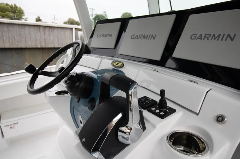  Yacht Photos Pics 2025 HCB 42 Lujo boat helm with Garmin displays and steering wheel.