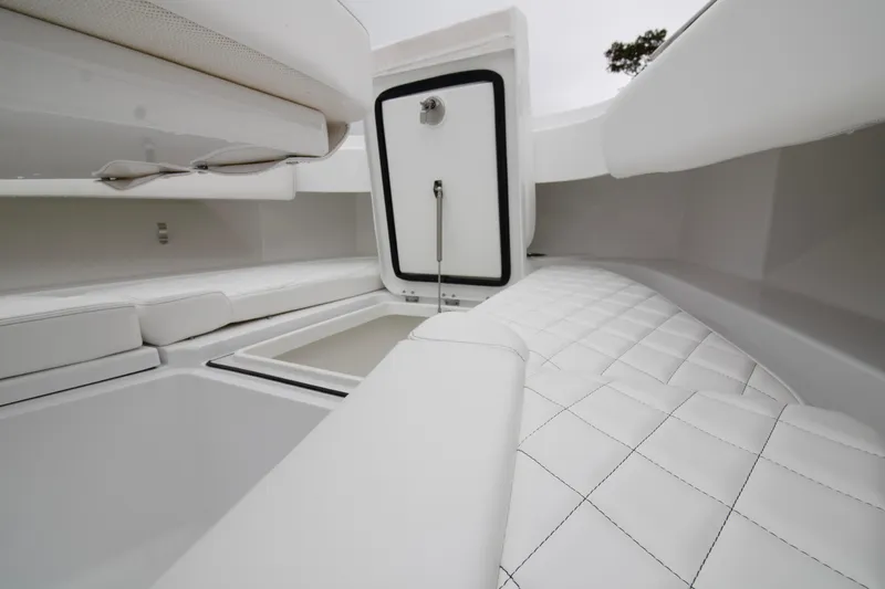  Yacht Photos Pics 2025 HCB 42 Lujo boat interior with white cushioned seating and storage compartments.