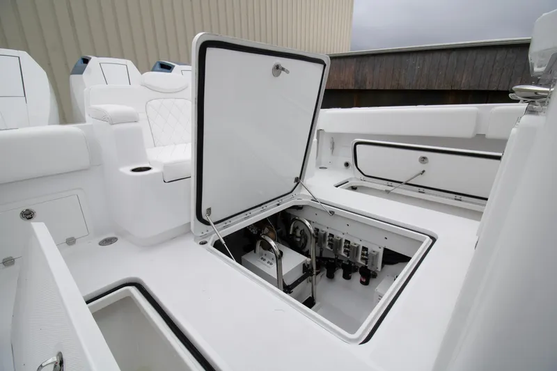  Yacht Photos Pics 2025 HCB 42 Lujo boat interior with open storage compartment.