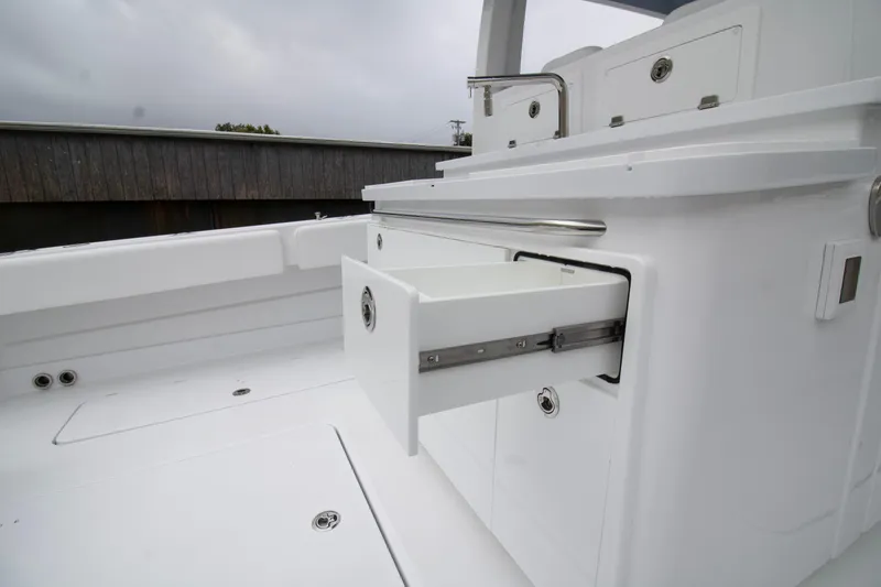  Yacht Photos Pics 2025 HCB 42 Lujo boat interior with open storage drawer.