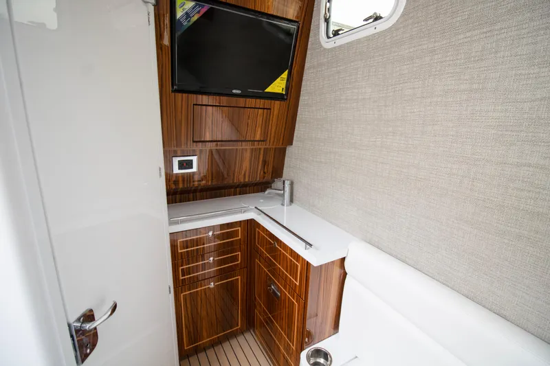  Yacht Photos Pics Interior of 2025 HCB 42 Lujo boat with wood cabinetry and modern amenities.
