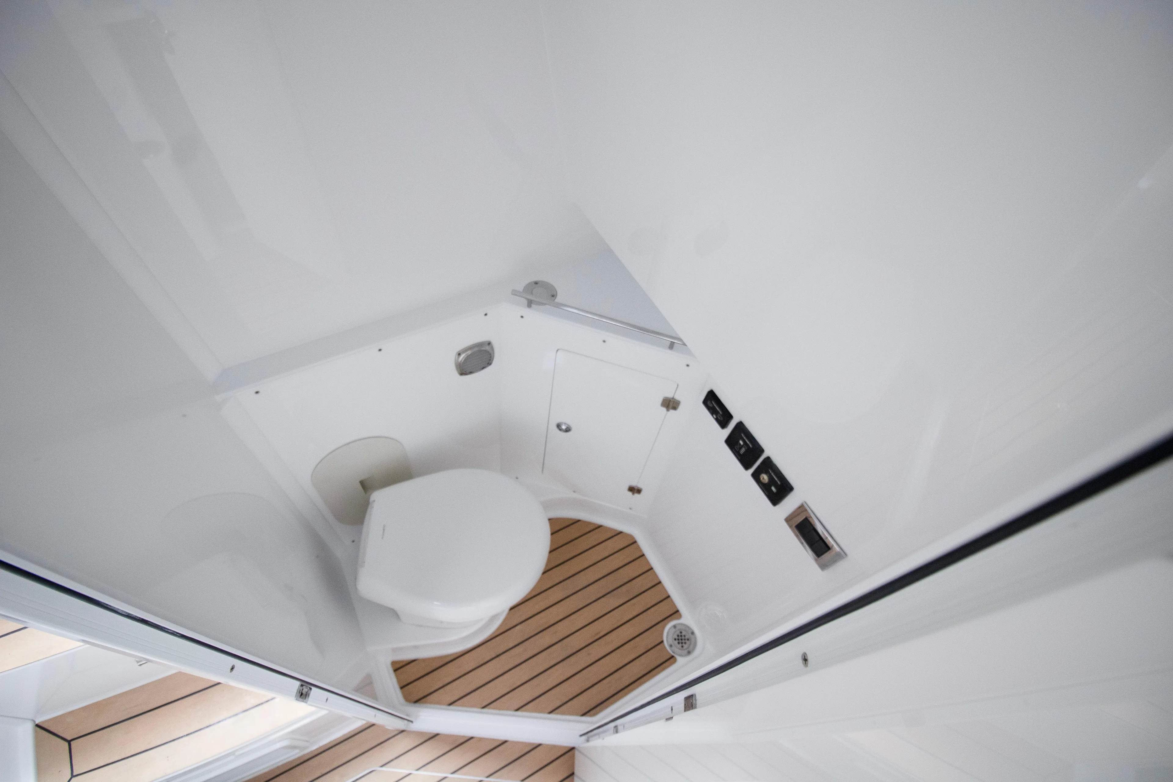  Yacht Photos Pics 2025 HCB 42 Lujo boat interior bathroom with modern fixtures and wooden flooring.